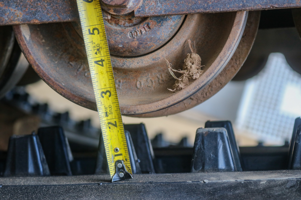 Checking the Space Between the Rollers and the Track Teeth