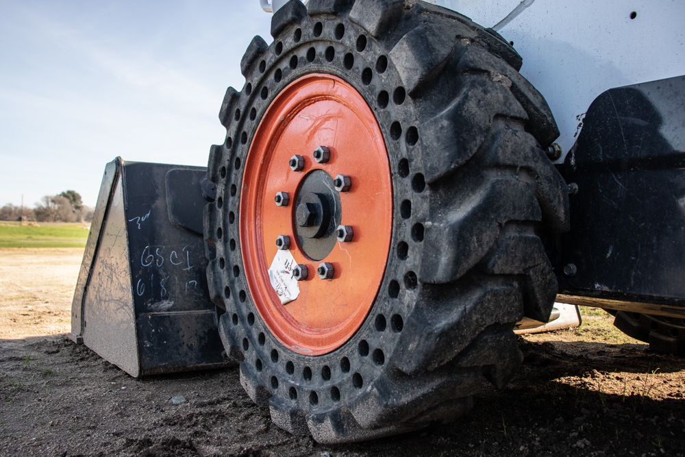 Wheels or Tracks for Skid Steers?